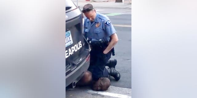 In this Monday, May 25, 2020, frame from video provided by Darnella Frazier, a Minneapolis officer kneels on the neck of a handcuffed man who was pleading that he could not breathe in Minneapolis.  (Darnella Frazier via AP)