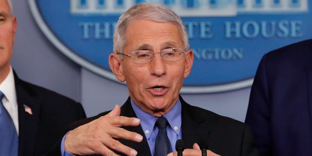 FILE - In this Saturday, Feb. 29, 2020 file photo, National Institute for Allergy and Infectious Diseases Director Dr. Anthony Fauci speaks as President Donald Trump and Vice President Mike Pence listen during a briefing about the coronavirus in the press briefing room at the White House in Washington. At right is Robert Redfield, director of the Centers for Disease Control and Prevention. Fauci has said he isn't active in organized religion but credited his Jesuit schooling with burnishing the values that drive his public service. (AP Photo/Carolyn Kaster)