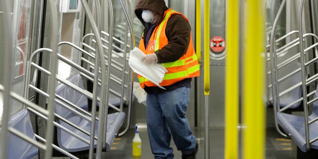In this May 5, 2020 file photo a New York Metropolitan Transportation authority worker worker disinfects a subway train at the Coney Island Stillwell Avenue Terminal, in the Brooklyn borough of New York. New York City appears to be on track to begin loosening restrictions in June, but residents who don't yet feel comfortable commuting by subway may have to improvise, NYC Mayor Bill de Blasio said Friday, May 29, 2020.