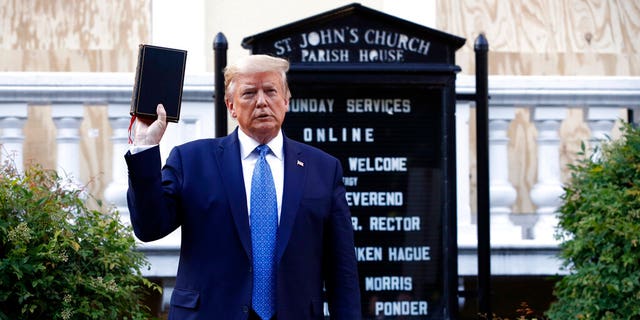 Melania Trump President Donald Trump holds a Bible as he visits St. John's Church across Lafayette Park from the White House June 1, in Washington. Part of the church was set on fire during protests on Sunday night. (AP Photo/Patrick Semansky)