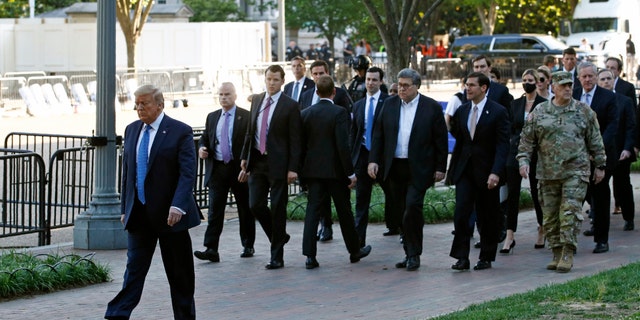 President Donald Trump walks in Lafayette Park to visit outside St. John's Church across from the White House Monday, June 1, 2020, in Washington. Part of the church was set on fire during protests on Sunday night. (AP Photo/Patrick Semansky)