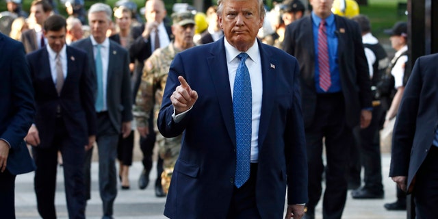 President Donald Trump returns to the White House after visiting outside St. John's Church, Monday, June 1, 2020, in Washington. Part of the church was set on fire during protests on Sunday night. (AP Photo/Patrick Semansky)