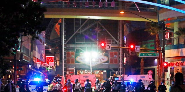 Police stand in formation at the entrance to Fremont Street Experience Monday, June 1, 2020, in downtown Las Vegas. Police were present for a community protest over the death of George Floyd, a Minneapolis man who died in police custody on Memorial Day.