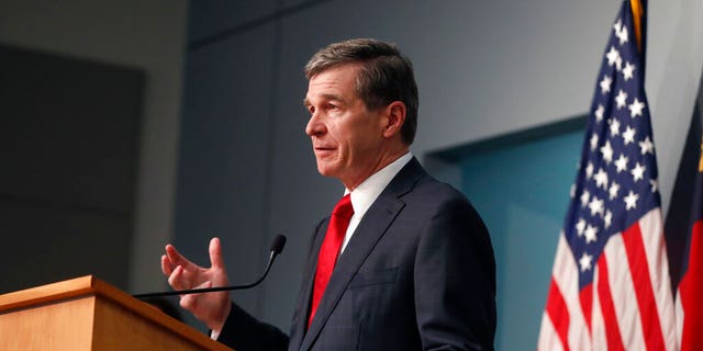 North Carolina Gov. Roy Cooper speaking in Raleigh on Tuesday. (Ethan Hyman/The News & Observer via AP)