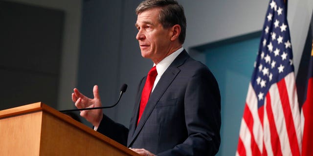 North Carolina Gov. Roy Cooper speaking in Raleigh on Tuesday. (Ethan Hyman/The News & Observer via AP)