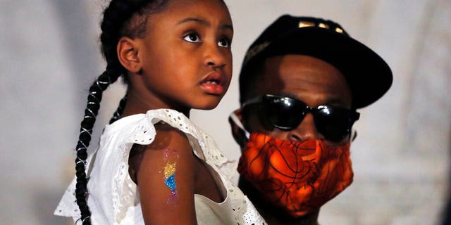 Gianna Floyd, the daughter of George Floyd, listens to a news conference with Stephen Jackson, June 2, in Minneapolis, Minn. 