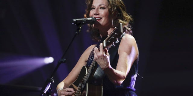In this Oct. 15, 2019 file photo, singer Amy Grant performs during the Dove Awards in Nashville, Tenn. Grant has had open heart surgery to fix a heart condition she has had since birth. A publicist for the singer said doctors discovered the condition during a routine checkup.