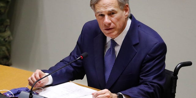 Texas Gov. Greg Abbott speaks at a news conference at city hall in Dallas. Officials in the San Antonio area issued an executive order Wednesday requiring the wearing of face masks when social distancing is not practical. (AP Photo/LM Otero, File)