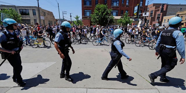 Demonstrators march during the Chicago March for Justice in honor of George Floyd in Chicago, Saturday, June 6, 2020. 