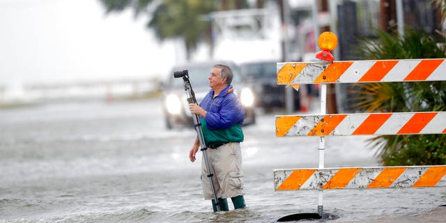 Charles Marsala recording a rising storm surge from Lake Pontchartrain in advance of Tropical Storm Cristobal on Sunday.