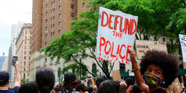 FILE - In this June 6, 2020, file photo, protesters march in New York. Since Floyd’s killing, police departments have banned chokeholds, Confederate monuments have fallen and officers have been arrested and charged. The moves come amid a massive, nationwide outcry against violence by police and racism. (AP Photo/Ragan Clark, File)