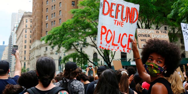 FILE - In this June 6, 2020, file photo, protesters march in New York. Since Floyd’s killing, police departments have banned chokeholds, Confederate monuments have fallen and officers have been arrested and charged. The moves come amid a massive, nationwide outcry against violence by police and racism. (AP Photo/Ragan Clark, File)