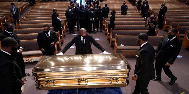 The casket of George Floyd is placed in the chapel during a funeral service at Fountain of Praise church, June 9, 2020, in Houston.