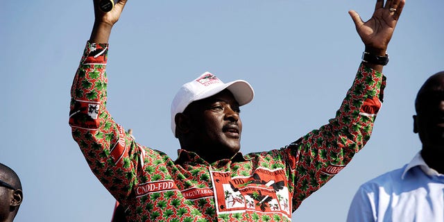 FILE - In this Thursday, June 24, 2010 file photo, Burundi's President Pierre Nkurunziza gestures to supporters during his electoral campaign in Gatumba, 20km from the capital Bujumbura, in Burundi. Burundi's government said Tuesday, June 9, 2020 that President Pierre Nkurunziza has died of a heart attack. (AP Photo/Marc Hofer, File)