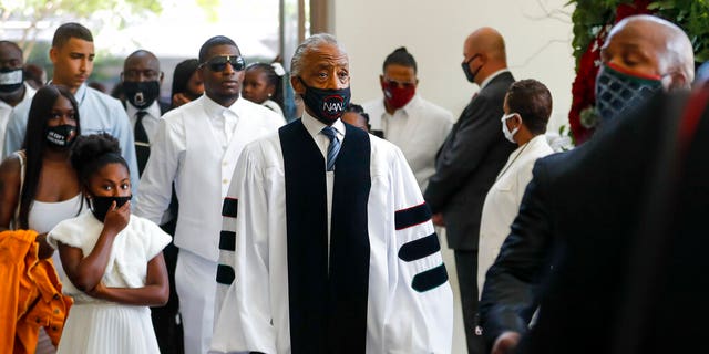 Rev. Al Sharpton entering the church for the funeral for George Floyd on Tuesday at The Fountain of Praise church in Houston. (Godofredo A. Vásquez/Houston Chronicle via AP, Pool)