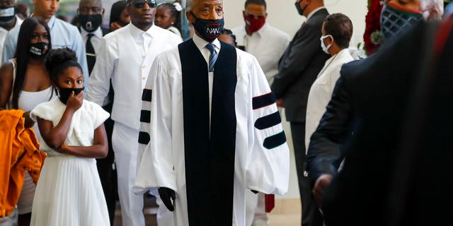 Rev. Al Sharpton entering the church for the funeral for George Floyd on Tuesday at The Fountain of Praise church in Houston. (Godofredo A. Vásquez/Houston Chronicle via AP, Pool)