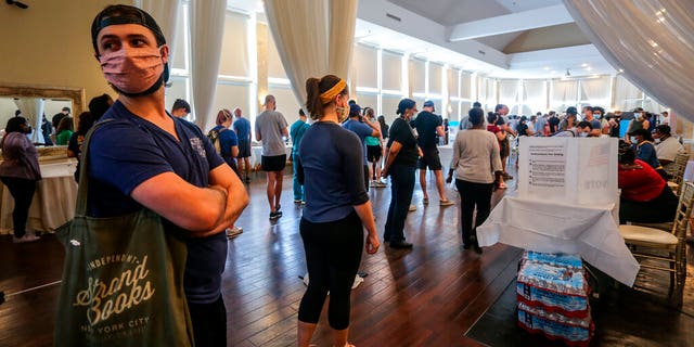 Voters wait in line to cast their ballots in the state's primary election at a polling place, Tuesday, June 9, 2020, in Atlanta. Some voting machines went dark and voters were left standing in long lines in humid weather as the waiting game played out. (Associated Press)