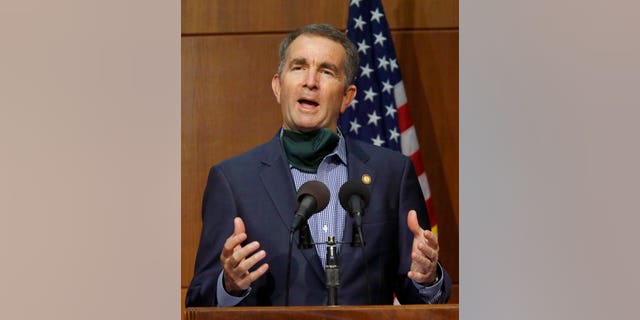 Virginia Gov. Ralph Northam answers a question during a press briefing inside the Patrick Henry Building in Richmond, V. Tuesday, June 9, 2020. (Bob Brown/Richmond Times-Dispatch via AP)