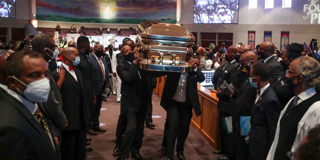 Pallbearers recess out of the church with the casket following the funeral for George Floyd on Tuesday, June 9, 2020, at The Fountain of Praise church in Houston.