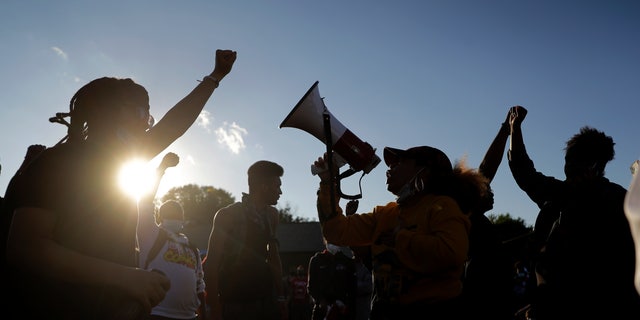 Protesters blocking a street outside the police station in Florissant, Mo., last week.