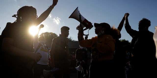 Protesters blocking a street outside the police station in Florissant, Mo., last week.