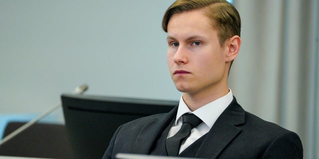 Defendant Philip Manshaus sits in a court room in Asker and Baerum district court in Sandvika, Norway, as he waits for the verdict on the last day of his trial, Thursday, Jun 11, 2020. The Norwegian man is charged with murder and terrorism in the killing of his stepsister and the storming of an Oslo mosque, and, according to a Norwegian prosecutor, should get the maximum 21 years in prison. (Håkon Mosvold Larsen/NTB Scanpix via AP, POOL)