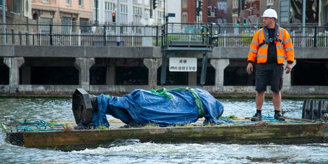 The council says it has been taken to a "secure location" and will end up in a museum. Colston built a fortune transporting enslaved Africans across the Atlantic, and left most of his money to charity. (Bristol City Council via AP)