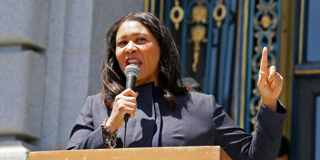 FILE: San Francisco Mayor London Breed speaks to a group protesting police racism outside City Hall in San Francisco.