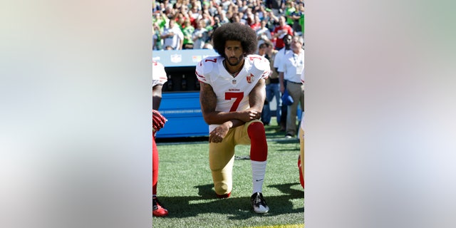 FILE - In this Sept. 25, 2016, file photo, San Francisco 49ers' Colin Kaepernick kneels during the national anthem before an NFL football game against the Seattle Seahawks in Seattle. The NFL, which has raised $44 million in donations through its Inspire Change program, announced the additional $206 million commitment Thursday, June 11, 2020. Kaepernick and others began kneeling during the national anthem in 2016 to protest social injustice and police brutality. He has not found an NFL job the last three seasons. (AP Photo/Ted S. Warren, File)