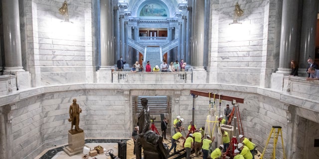 “Now, every child who walks into their Capitol feels welcome. Today we took a step forward for the betterment of every single Kentuckian," said Gov. Andy Beshear. (Ryan C. Hermens/Lexington Herald-Leader via AP)
