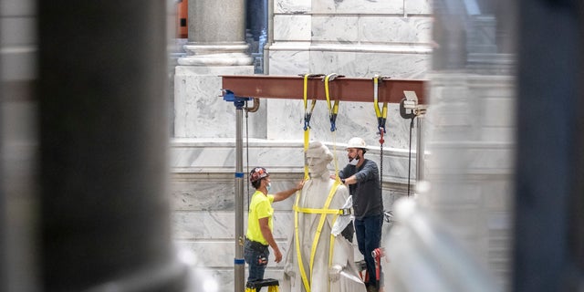 Calls to remove Confederate monuments, seen as symbols of slavery, have swept the nation following the death of George Floyd in police custody in Minneapolis on May 25. (Ryan C. Hermens/Lexington Herald-Leader via AP)