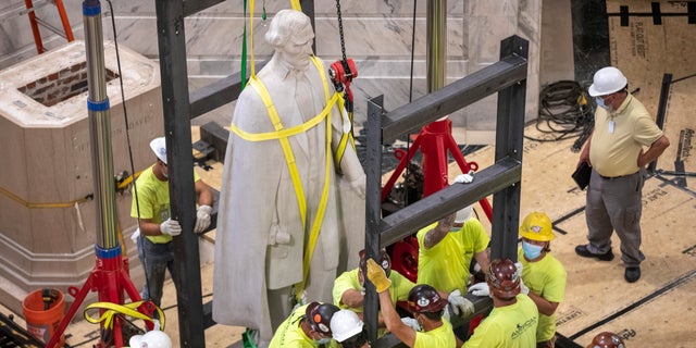 A Kentucky commission voted to take down a statue of Confederate President Jefferson Davis from the state Capitol. The panel supported a push from the governor as the country faces protests against police brutality following the deaths of African Americans in encounters with police. (Ryan C. Hermens/Lexington Herald-Leader via AP)