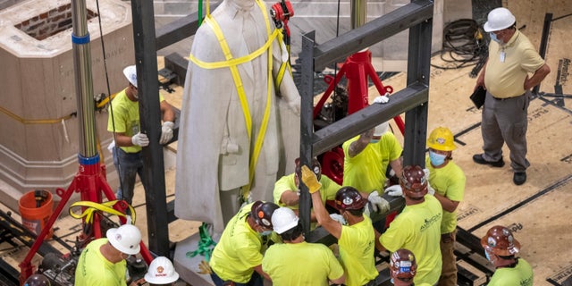 A Kentucky commission voted to take down a statue of Confederate President Jefferson Davis from the state Capitol. The panel supported a push from the governor as the country faces protests against police brutality following the deaths of African Americans in encounters with police. (Ryan C. Hermens/Lexington Herald-Leader via AP)
