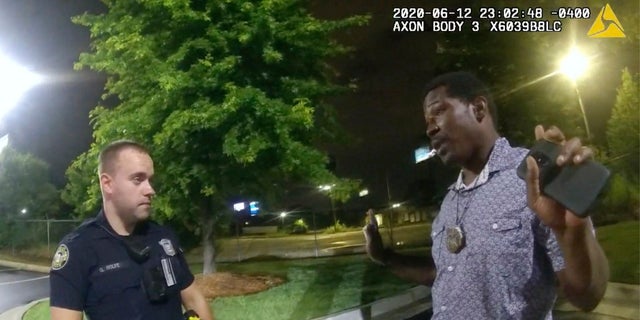 This screen grab taken from body camera video provided by the Atlanta Police Department shows Rayshard Brooks speaking with Officer Garrett Rolfe in the parking lot of a Wendy's restaurant, late Friday, June 12, 2020, in Atlanta. (AP/Atlanta Police Department)