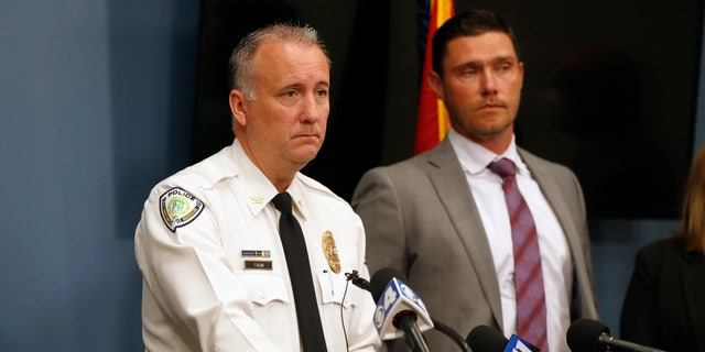 Florissant Police Chief Timothy Fagan, left, speaking alongside St. Charles County Prosecuting Attorney Tim Lohmar, right, during a news conference Wednesday.