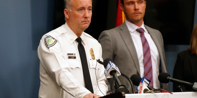 Florissant Police Chief Timothy Fagan, left, speaking alongside St. Charles County Prosecuting Attorney Tim Lohmar, right, during a news conference Wednesday.