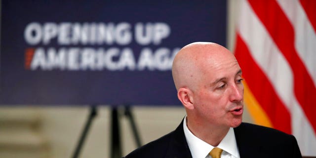 Nebraska Gov. Pete Ricketts speaks during a roundtable with President Trump on the reopening of America's small businesses, in the State Dining Room of the White House, Thursday, June 18, 2020, in Washington. 