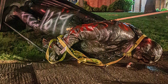 <br> A statue of George Washington, that was erected in the 1920s, is shown on the ground after it was taken down by protesters in Portland, Ore., June 18, 2020. (Associated Press)