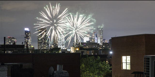 FILE - In this June 19, 2020, file photo fireworks explode during Juneteenth celebrations above the Bedford-Stuyvesant neighborhood in the Brooklyn borough of New York. The Manhattan skyline is seen in the background. (AP Photo/John Minchillo, File)