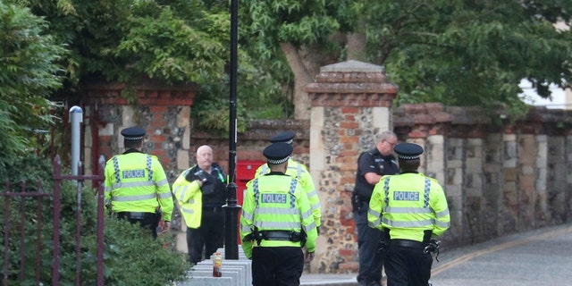 Police arrive at Forbury Gardens in the town centre of Reading, England, on Saturday, June 20, 2020. (Associated Press)