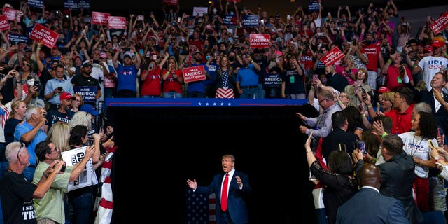 President Donald Trump arrives on stage to speak at a campaign rally at the BOK Center, Saturday, June 20, 2020, in Tulsa, Okla. (AP Photo/Evan Vucci)