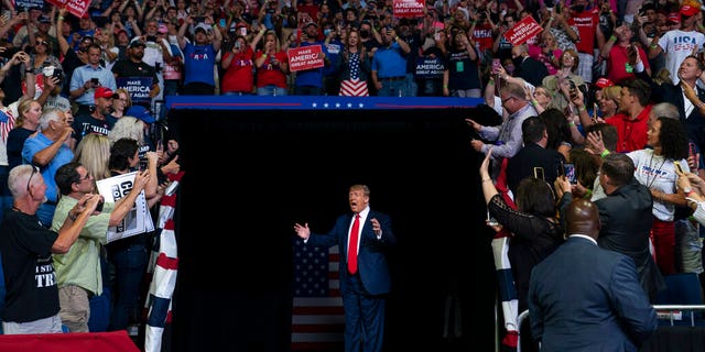 President Donald Trump arrives on stage to speak at a campaign rally at the BOK Center, Saturday, June 20, 2020, in Tulsa, Okla. (AP Photo/Evan Vucci)