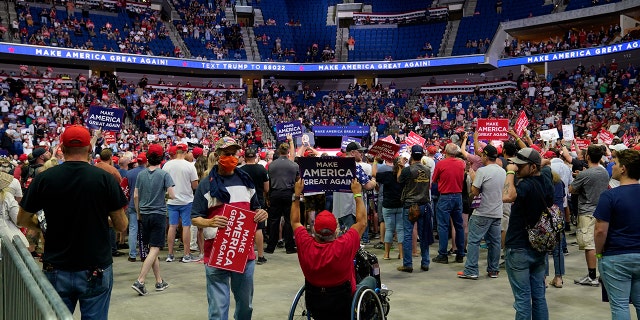 President Donald Trump supporters listen to Trump speak during a campaign rally at the BOK Center, Saturday, June 20, 2020, in Tulsa, Okla. (AP Photo/Evan Vucci)