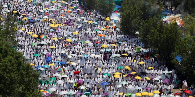 In this Aug. 10, 2019 file photo, hundreds of thousands of Muslim pilgrims pray outside Namira Mosque in Arafat during the annual hajj pilgrimage, near the holy city of Mecca, Saudi Arabia. (AP Photo/Amr Nabil, File)