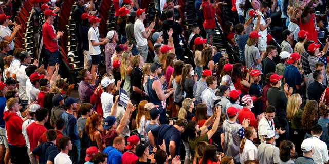 Supporters listen as President Trump speaks to a group of young Republicans at Dream City Church, Tuesday, June 23, 2020, in Phoenix. (AP Photo/Evan Vucci)