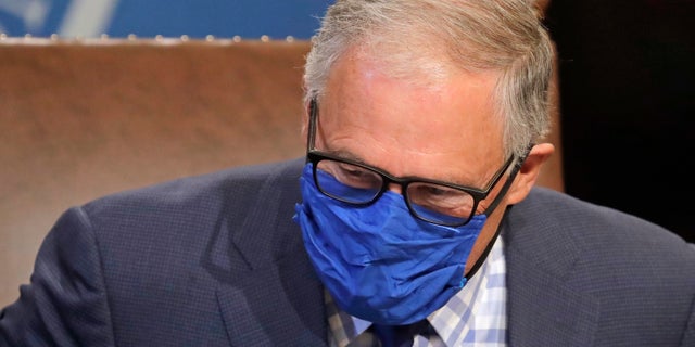 Washington Gov. Jay Inslee wears a face mask as he concludes a news conference at the Capitol in Olympia, June 23, 2020, . (Associated Press)