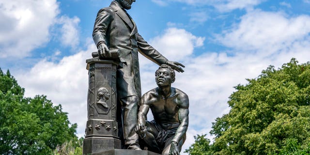 The Emancipation Memorial in Washington's Lincoln Park depicts a freed slave kneeling at the feet of President Abraham Lincoln, Thursday, June 25, 2020. Calls are intensifying for the removal of the statue as the nation confronts racial injustice. (AP Photo/J. Scott Applewhite)