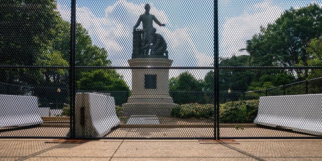 Barriers are erected around the Emancipation Memorial in Washington, which depicts a freed slave kneeling at the feet of President Abraham Lincoln, Thursday, June 25, 2020. Calls are intensifying for the removal of the statue as the nation confronts racial injustice. (AP Photo/J. Scott Applewhite)