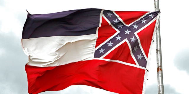 <br>​​​​The recently retired Mississippi state flag flies outside the Statehouse in Jackson, June 25, 2020. (Associated Press)