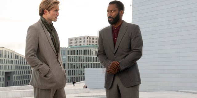 Robert Pattinson, left, and John David Washington in a scene from 